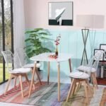 سفرة مطبخ 4 كراسي مودرن – ترابيزة طعام بيضاء وكراسي شفافة بأرجل خشب